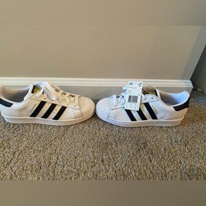 Women’s size 6.5 white and black adidas superstar sneakers.